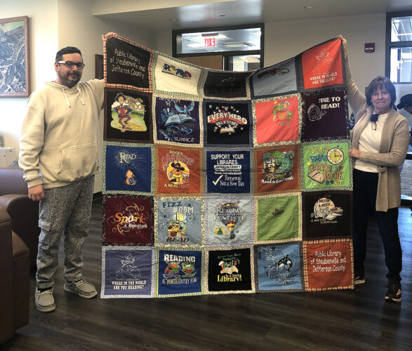 Drawing for quilt made from Tshirts part of book sale News, Sports